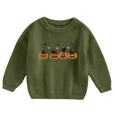 Green sweater with Halloween-themed design on a white background