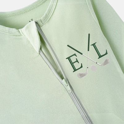 Light green bamboo golf pjs with a zipper and 'EL' initials on a white background