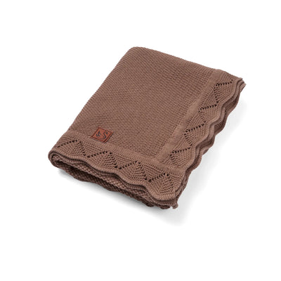 Brown knitted blanket with a logo on a white background