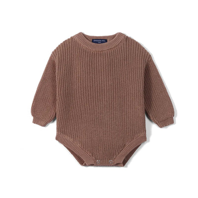 Brown knitted baby romper on a white background