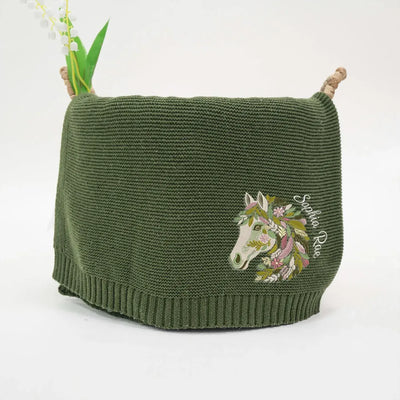 Forest green personalized baby blanket with embroidered horse floral design on a white background
