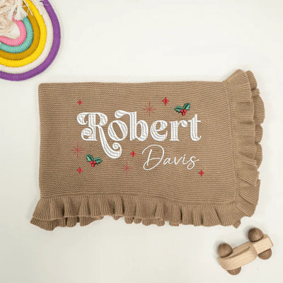 Mocha personalized baby blanket with embroidered name 'Robert Davis' on a light background