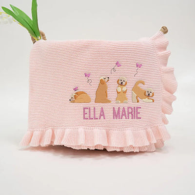 Pink personalized baby blanket with embroidered golden doodles and 'Ella Marie' text on a white background